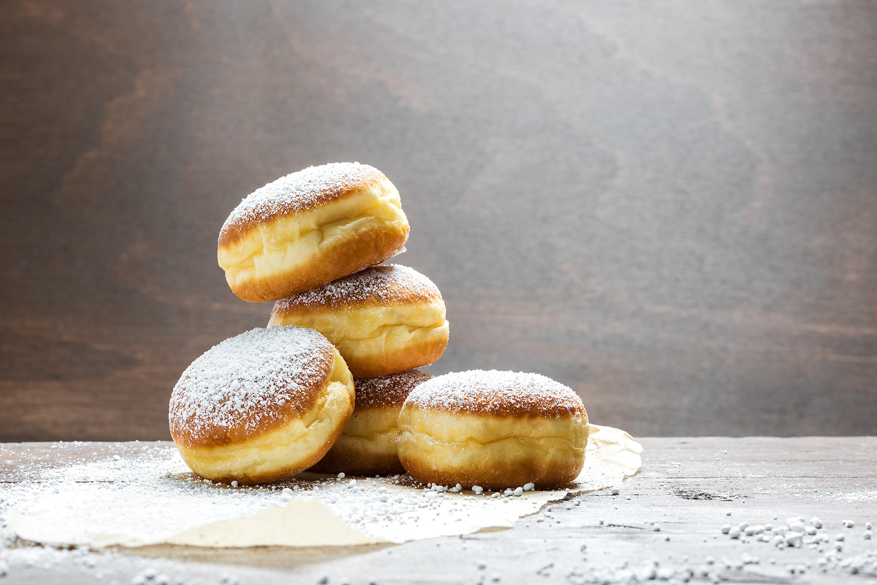a stack of vegan donuts on a rustic background